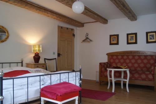 En eller flere senge i et værelse på Zweite Heimat Privatpension