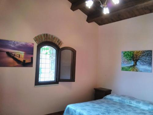 Ένα ή περισσότερα κρεβάτια σε δωμάτιο στο Villaggio dei Balocchi