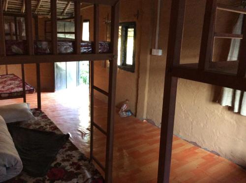 a room with two bunk beds and a hallway at My beautiful cottage in pokhara in Pokhara