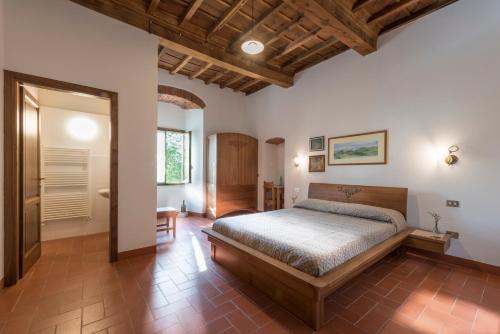 a bedroom with a bed in a room at Torre nel Chianti in Greve in Chianti