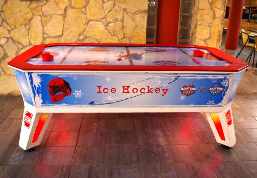 a ice hockey machine with the words ice hockey at Szent Orbán Erdei Wellness Hotel és Residence in Kóspallag