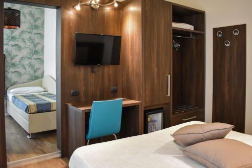 Postel nebo postele na pokoji v ubytování Hotel Dear Rimini