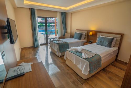 Katil atau katil-katil dalam bilik di Dalyan Live Spa Hotel