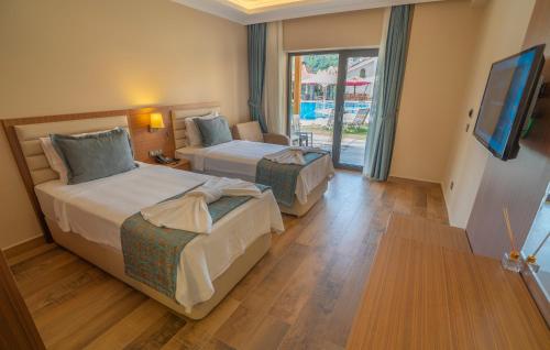 Katil atau katil-katil dalam bilik di Dalyan Live Spa Hotel