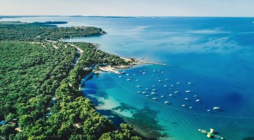 an aerial view of a island with boats in the water at Design Villa Noble with Spa in Bale