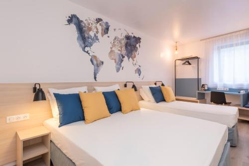 En eller flere senge i et værelse på Tulip Inn Antwerpen