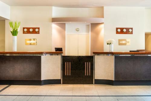 a lobby of a hotel with a reception desk at Copthorne Hotel Newcastle in Newcastle upon Tyne