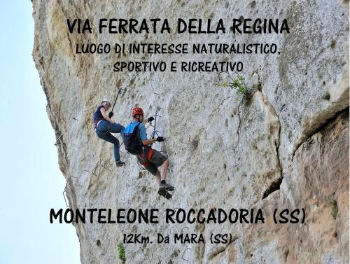 two people climbing on a rock wall at Antas in Padria