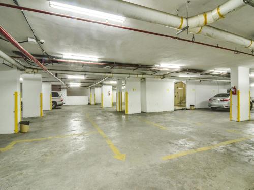 an empty parking garage with cars parked in it at Ajwa Suites for Furnished Units in Jeddah