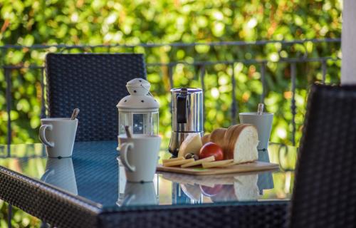 a glass table with a plate of food on it at Villa Sana in Selina