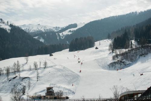 a group of people skiing down a snow covered slope at Appartement Else in Bad Kleinkirchheim