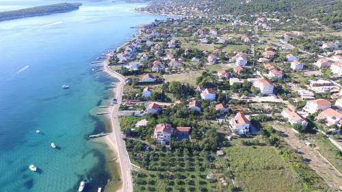 an aerial view of a small island in the water at MIRKO DIVING CENTER in Rab