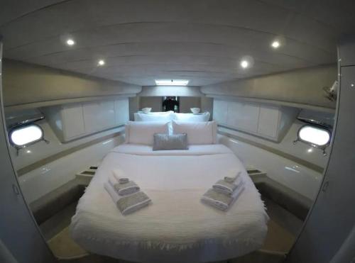 a large bed in the middle of a boat at Beautiful and magnific yacht in Lisbon