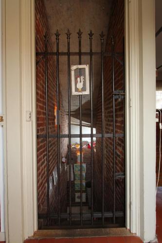 a door with a iron gate in a room at Le Clos Xavianne in Ribécourt-la-Tour