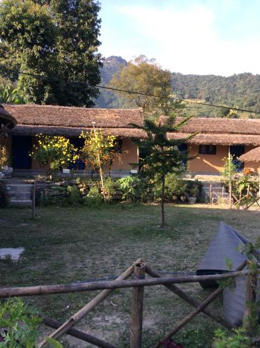 a wooden fence in front of a house at My beautiful cottage in pokhara in Pokhara