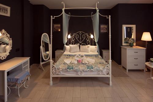 Tempat tidur dalam kamar di Boutique Hotel Musea Music and Time