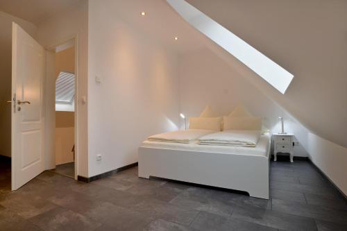 En eller flere senge i et værelse på Moselhof Ferienwohnungen