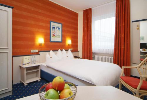 En eller flere senger på et rom på Hotel Ludwig Superior