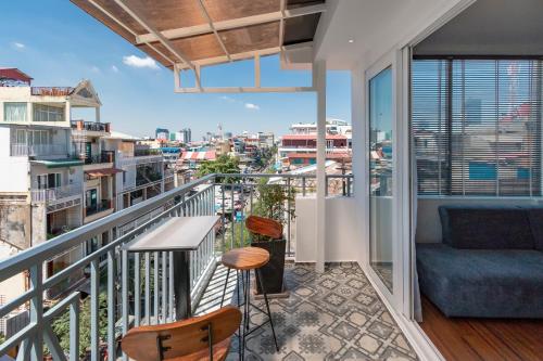a balcony with a view of a city at TAO Riverside Residence in Phnom Penh