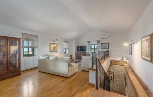 a living room with a couch and a staircase at Villa Luna in Selina in Selina