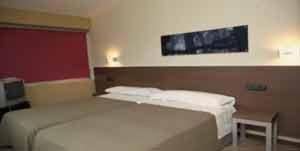 מיטה או מיטות בחדר ב-Hotel Izelai