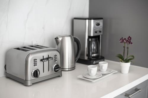 a kitchen counter with a toaster and coffee maker at Sobe Lux in Miami Beach