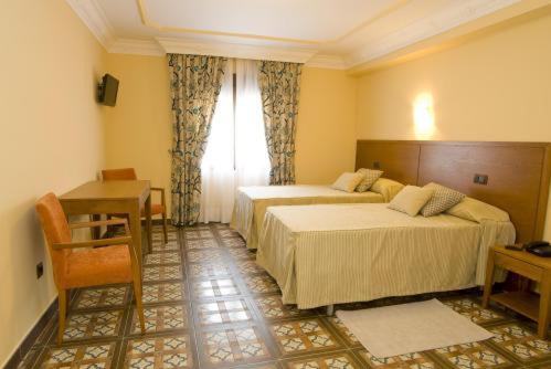 מיטה או מיטות בחדר ב-Hotel Casa José Díaz