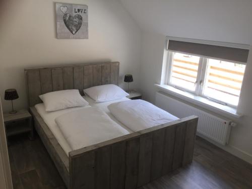 מיטה או מיטות בחדר ב-Gieters Mooist