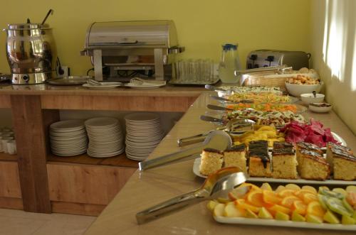 a buffet with many different types of food on a table at Hotel Toni in Gudauri