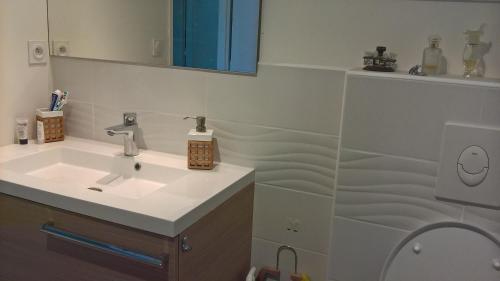 a bathroom with a sink and a mirror at DIVA in Roquebrune-sur-Argens