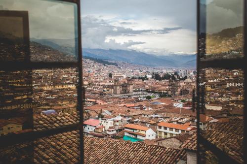 a view of a city from a tower at Loki Cusco in Cusco