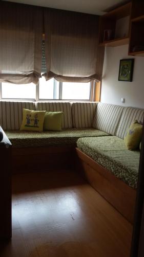 a small room with two beds in a train at Perfect Sea View in Vila do Conde