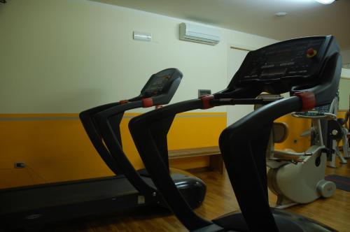a gym with two exercise bikes in a room at Hotel La Torre in Palinuro