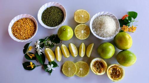 a group of bowls of food with lime and other ingredients at Nature Care Village- Rajaji National Park in Rishīkesh