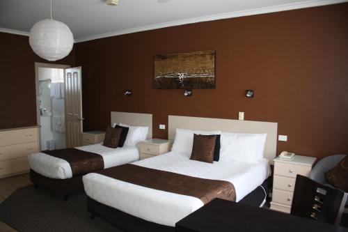Ένα ή περισσότερα κρεβάτια σε δωμάτιο στο Comfort Inn Robe