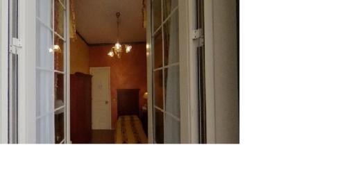 a view of a room with a mirror and a window at Hotel Joli in Palermo