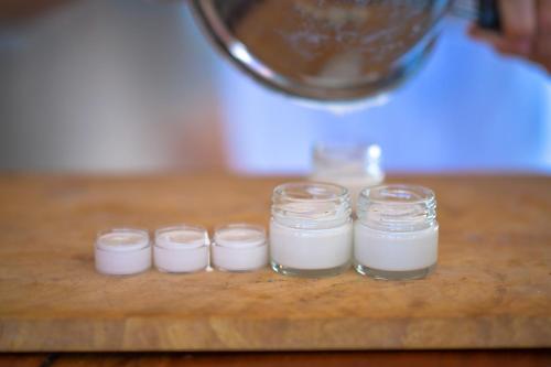 a group of four jars of milk on a cutting board at Kitesurfing Lanka in Kalpitiya
