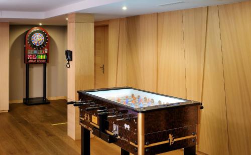 a pool table in the middle of a room at Hotel Visegrád in Visegrád