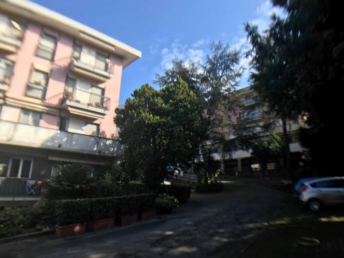 a street in front of a pink building at Appartamento del Golf - Secured Parking - in Rapallo