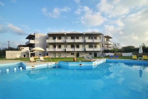 a large swimming pool in front of a building at Nereides Hotel in Kolymvari