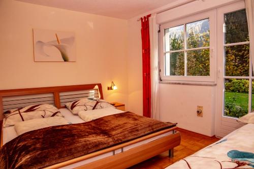 Postel nebo postele na pokoji v ubytování Haus Bitschnau