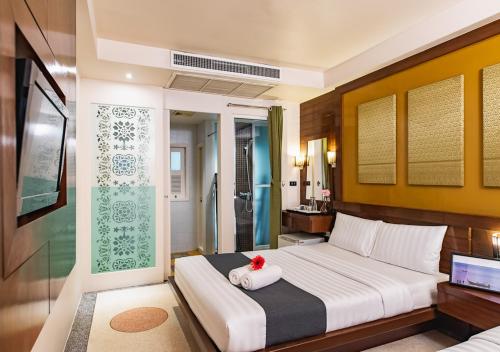 Tempat tidur dalam kamar di D&D Inn Khaosan