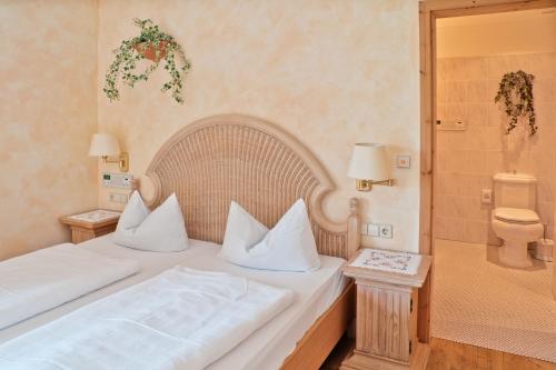 Ένα ή περισσότερα κρεβάτια σε δωμάτιο στο Privathotel Brügges Loui