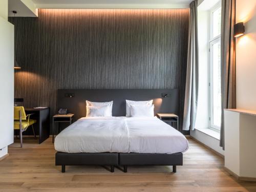 Łóżko lub łóżka w pokoju w obiekcie Hotel Kronacker