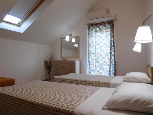 Voodi või voodid majutusasutuse Apartments Sunrise toas