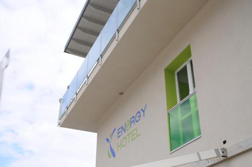 a side view of a hospital building with a window at Energy Hotel in Calceranica al Lago
