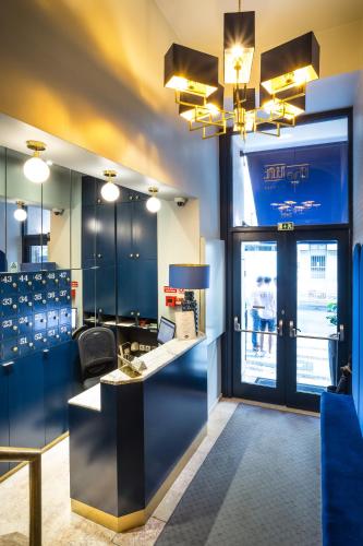 a lobby with a desk with a laptop on it at The Lift Boutique Hotel by RIDAN Hotels in Lisbon