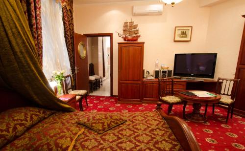 TV a/nebo společenská místnost v ubytování Boutique Hotel Monte Kristo