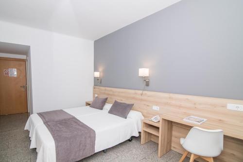 Letto o letti in una camera di Hotel Abelay