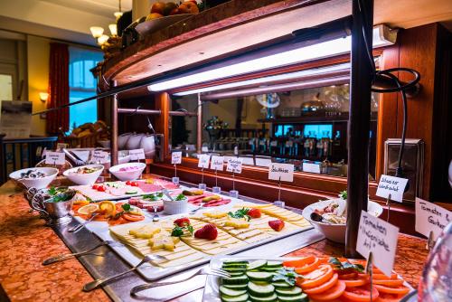 a buffet with many different types of food on display at Strandhotel Ostfriesenhof in Borkum